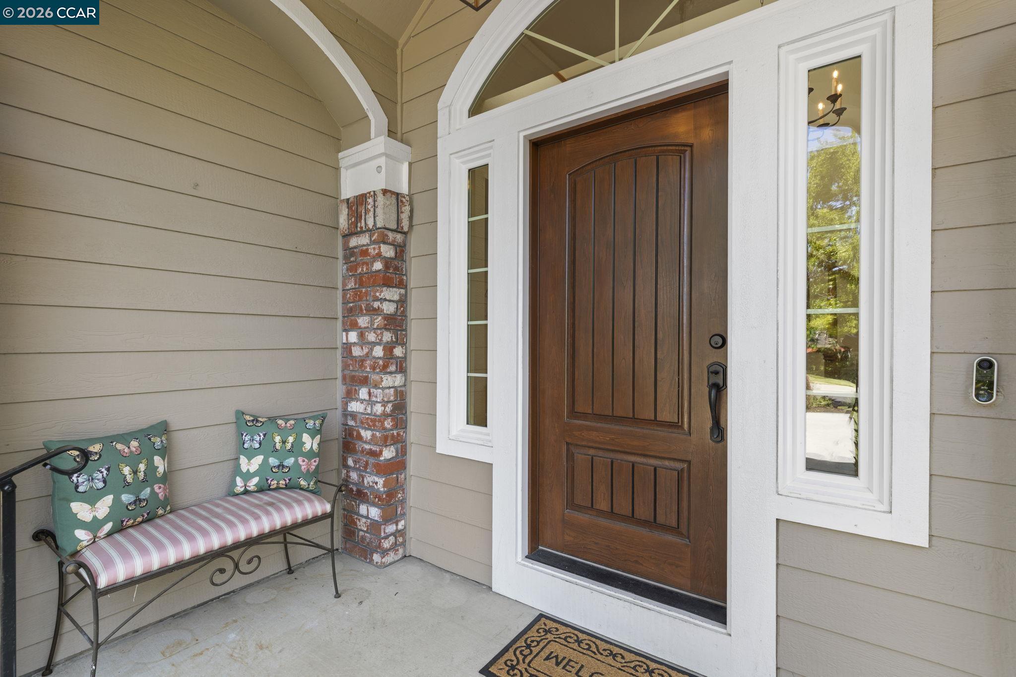1267 Quiet Circle Concord, CA 94521 - Photo 3 of 72 a view of a porch with furniture and front door