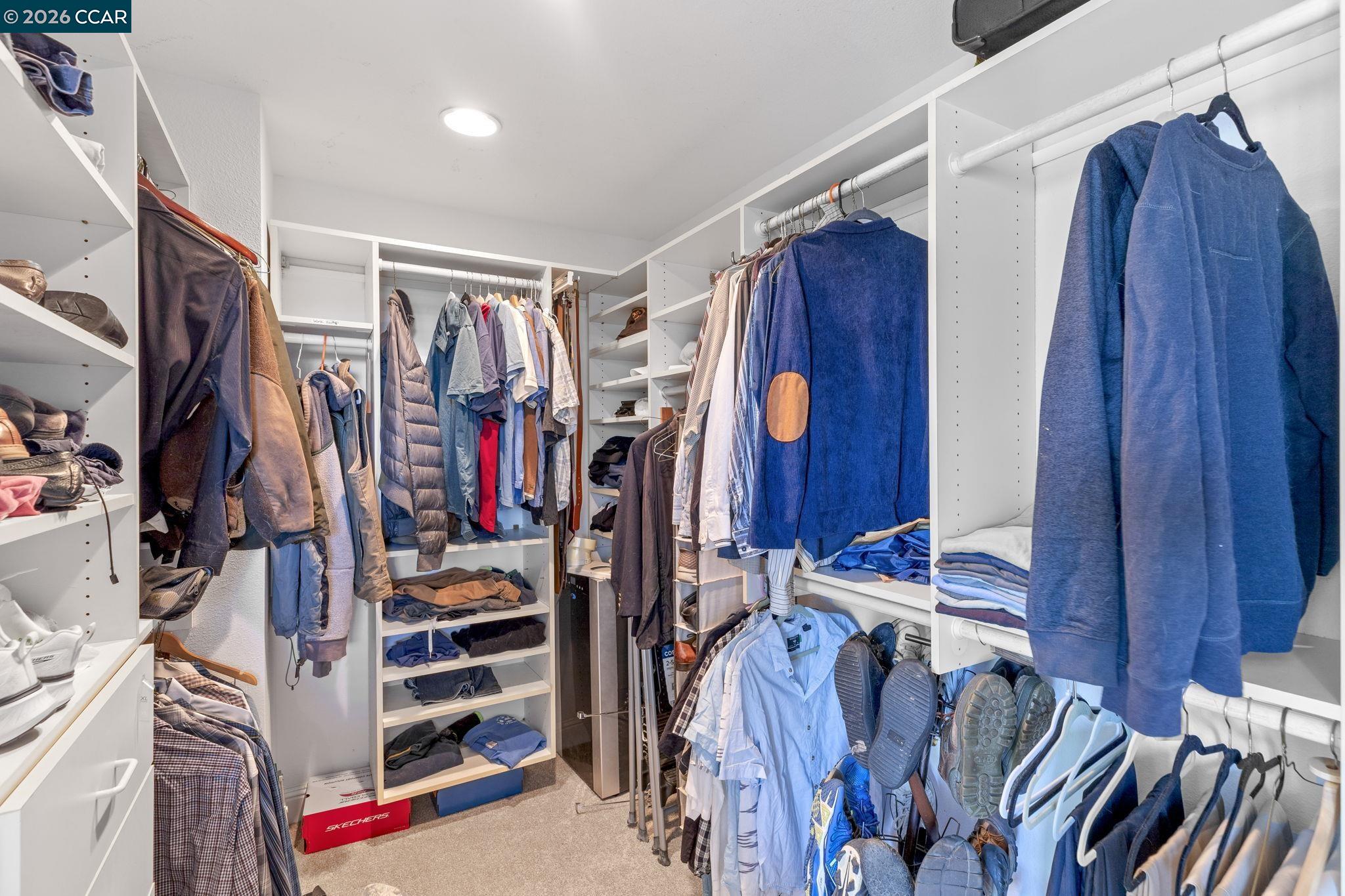 1267 Quiet Circle Concord, CA 94521 - Photo 33 of 72 a view of walk in closet with clothes