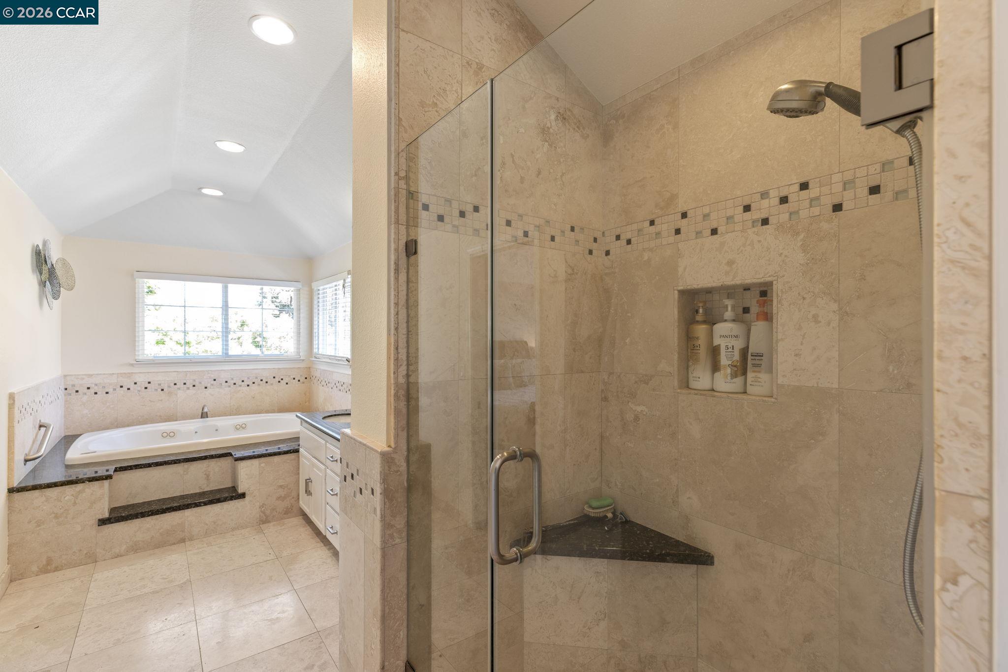 1267 Quiet Circle Concord, CA 94521 - Photo 37 of 72 a bathroom with a tub shower and mirror