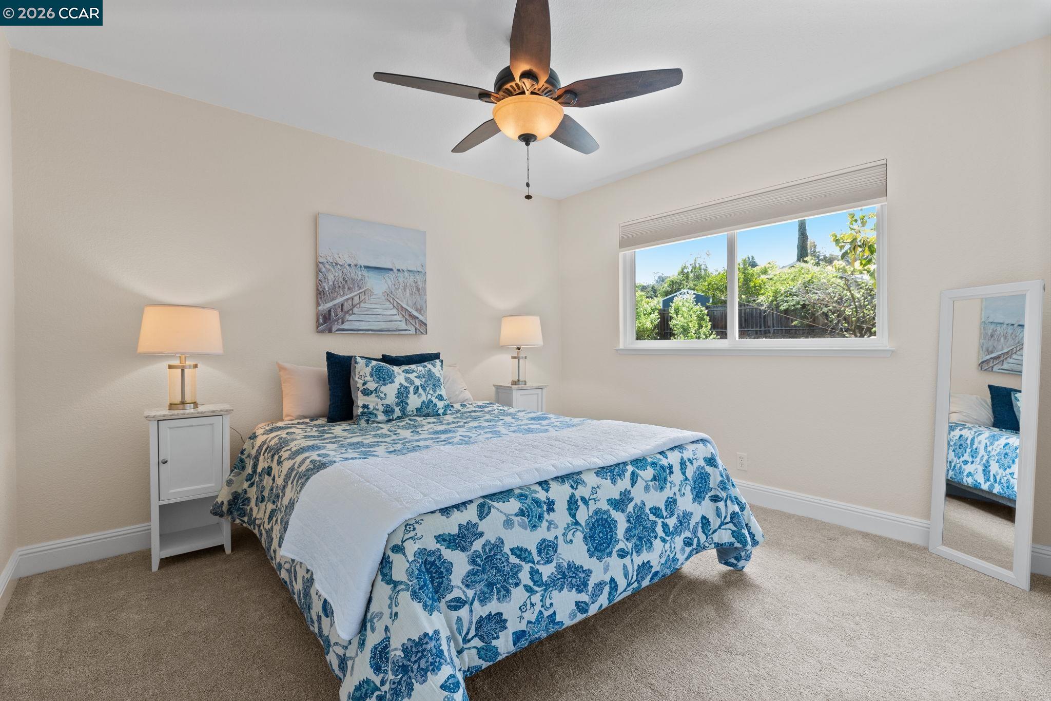 1267 Quiet Circle Concord, CA 94521 - Photo 38 of 72 a bedroom with a bed chandelier and a window