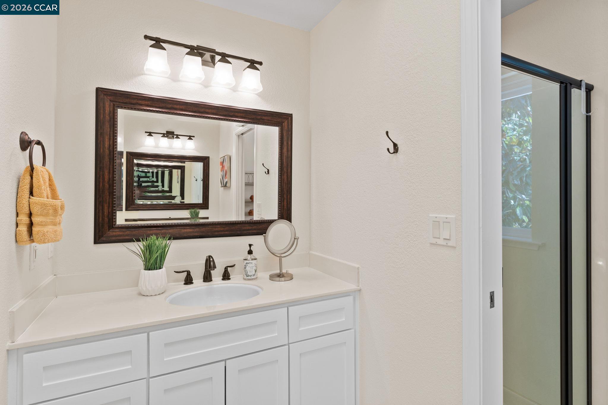 1267 Quiet Circle Concord, CA 94521 - Photo 43 of 72 a bathroom with a sink and a mirror