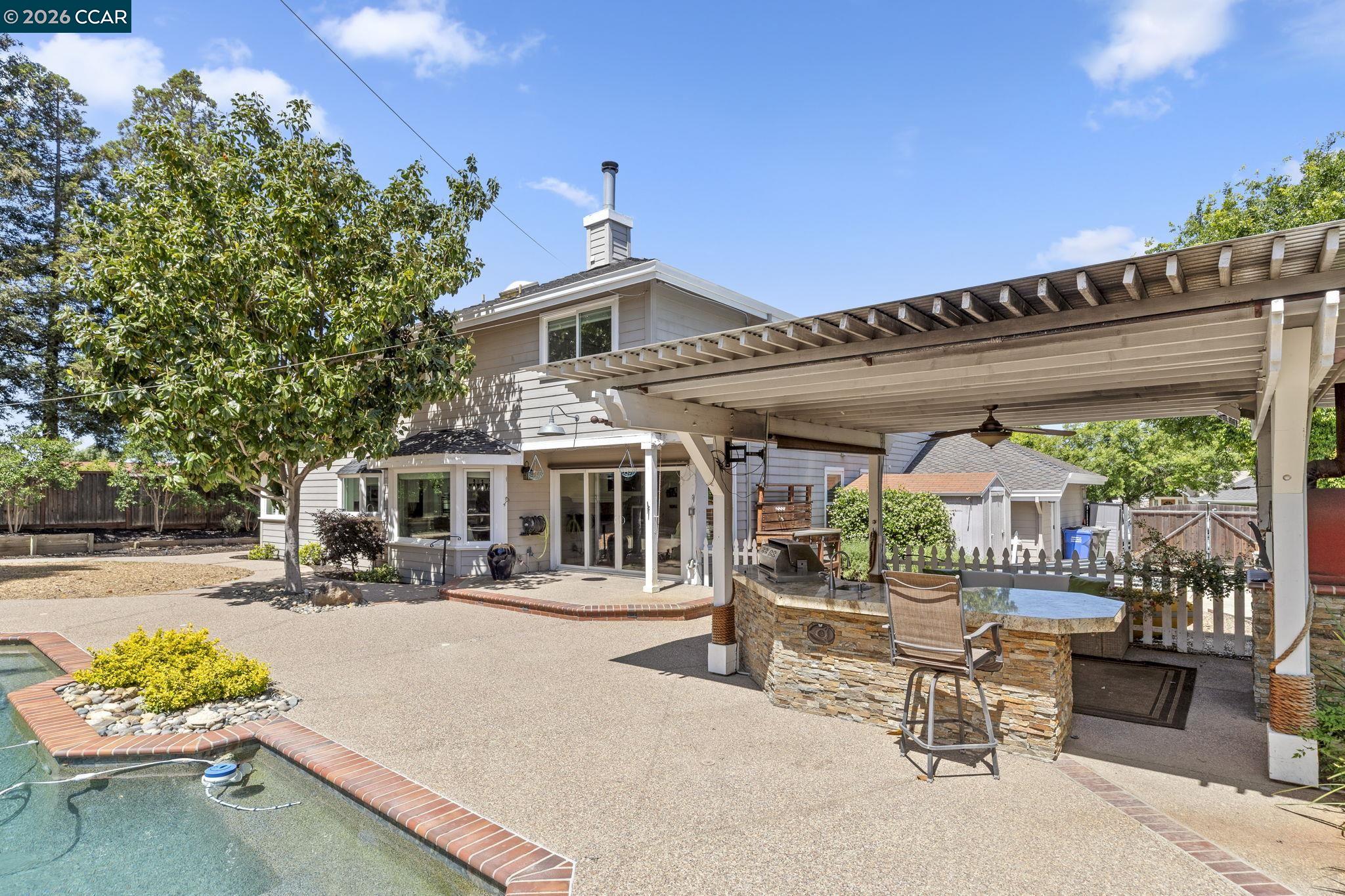1267 Quiet Circle Concord, CA 94521 - Photo 54 of 72 a patio with a table and chairs and potted plants