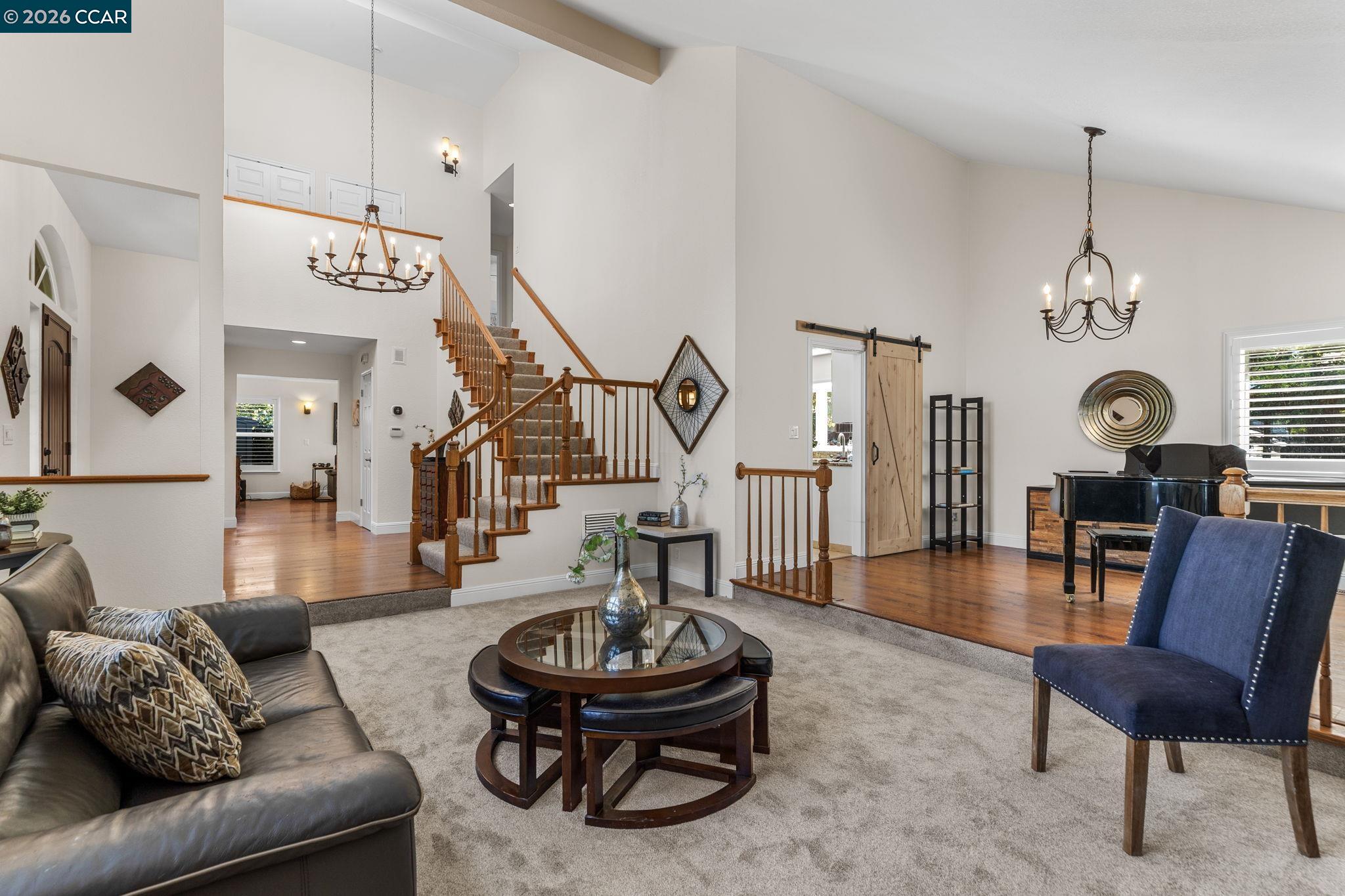 1267 Quiet Circle Concord, CA 94521 - Photo 7 of 72 a living room with furniture and a chandelier