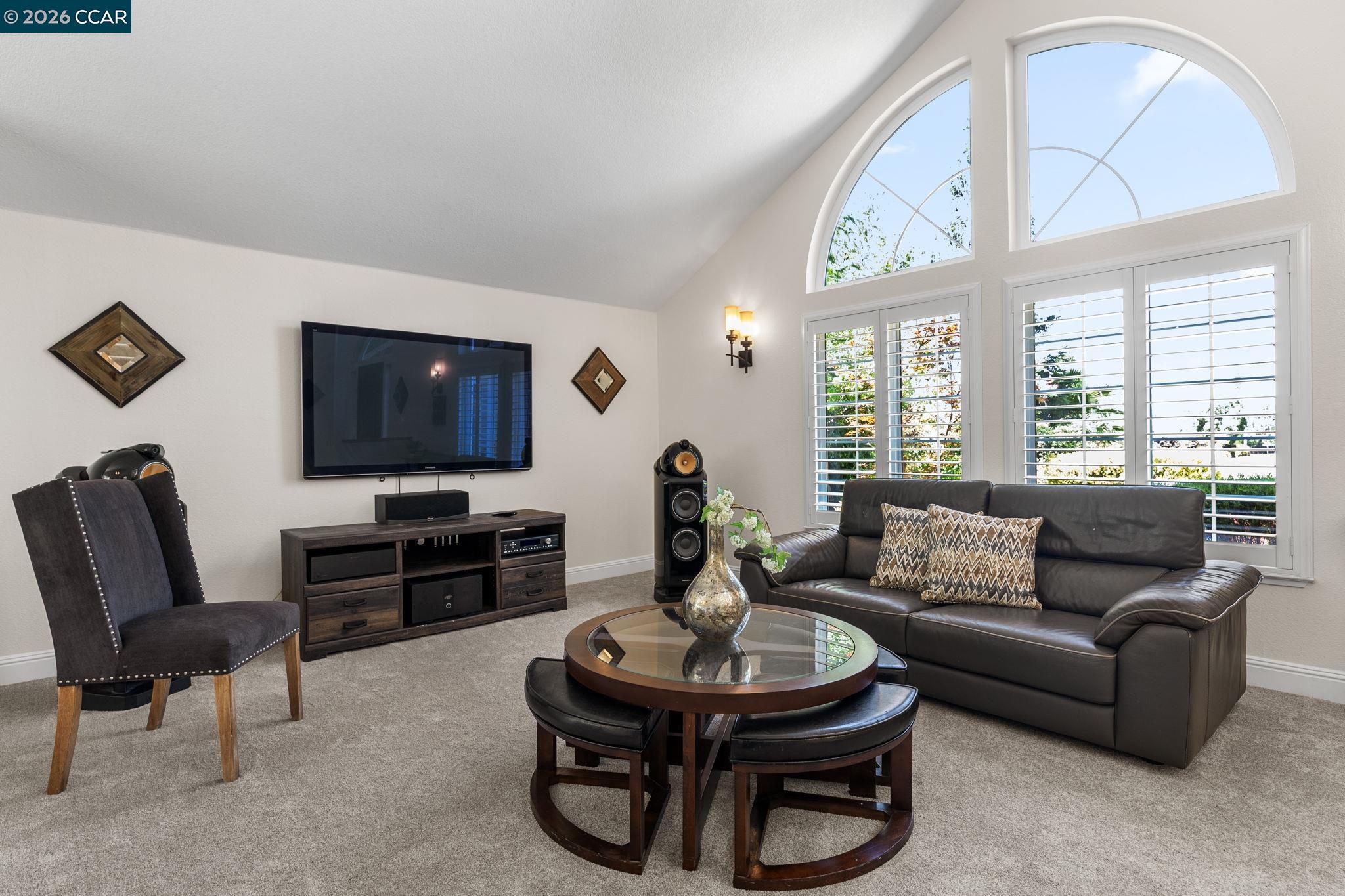 1267 Quiet Circle Concord, CA 94521 - Photo 10 of 72 a living room with furniture a large window and a flat screen tv