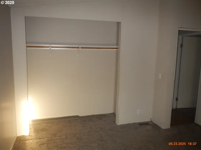 a view of an empty walk in closet