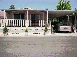 251 Ricardo Avenue Santa Rosa, CA 95407 - Photo 1 of 1 a view of a white house with large windows and wooden fence
