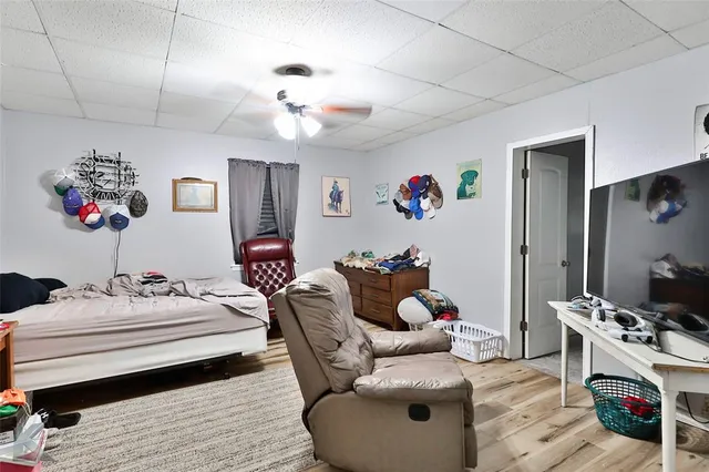 a living room with furniture and flowers