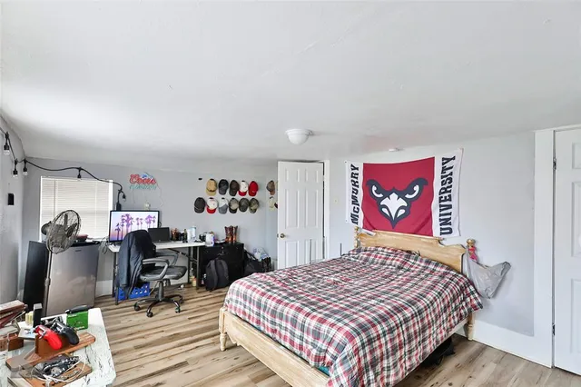 a bedroom with a bed and cabinets