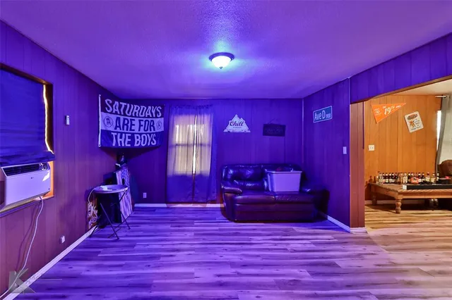 a view of a livingroom with furniture window and wooden floor