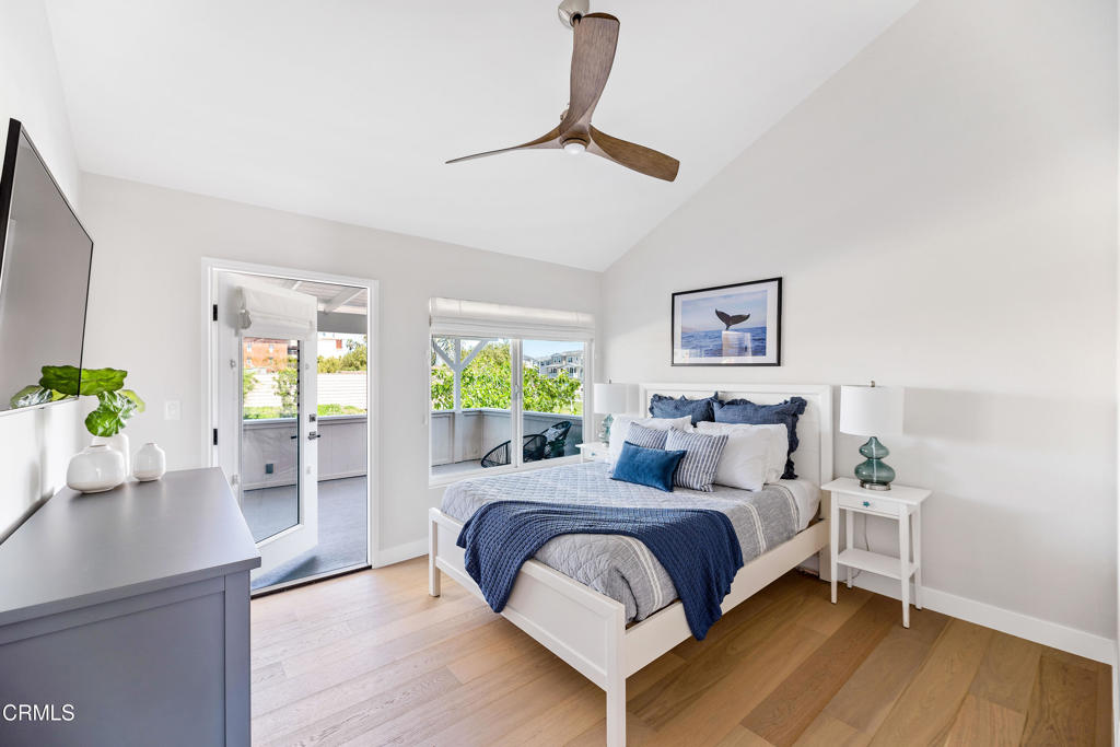 a bedroom with a bed window and table