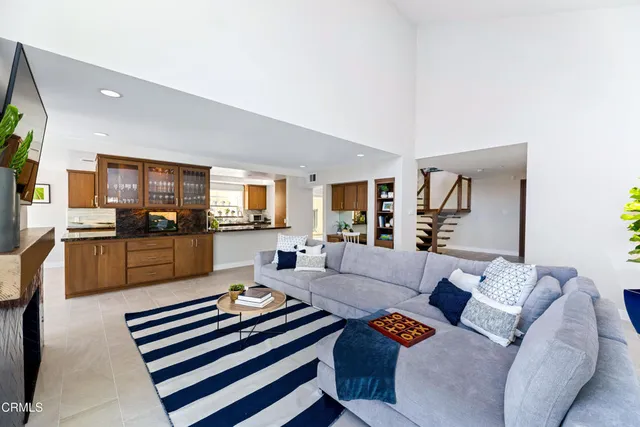 a living room with furniture or couch and a bookshelf