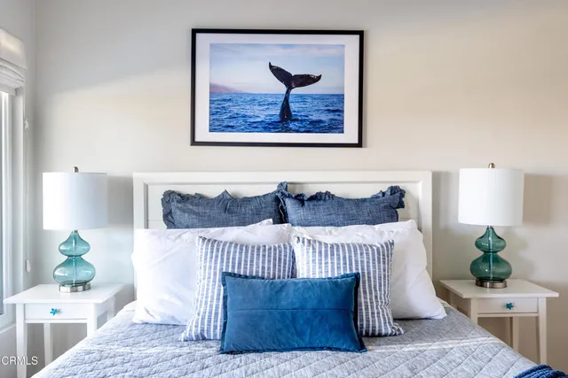 a bedroom with a bed and a couch