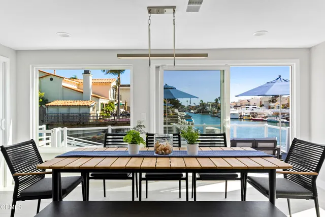 a living room with furniture a rug and a chandelier