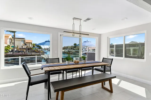 a view of a dining room with furniture and a rug