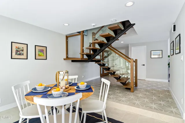 a view of entryway with wooden floor and stairs
