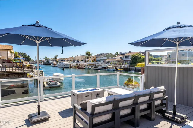 a view of a lake with boats and trees in the background