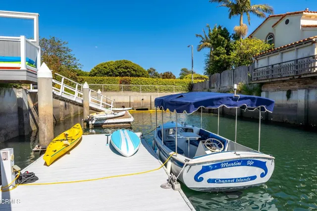 a view of a lake with outside a house