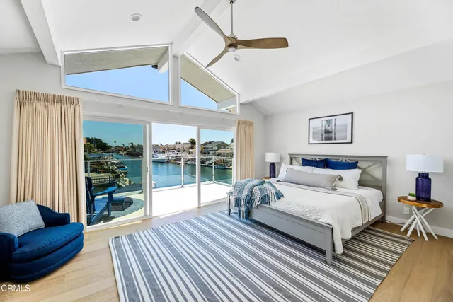 a bedroom with a bed and a lamp