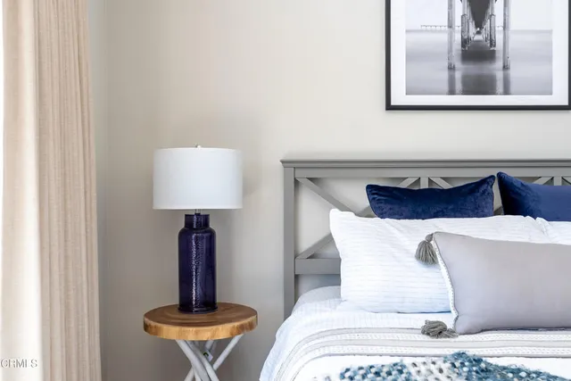 a view of a ocean with boats and trees in the background