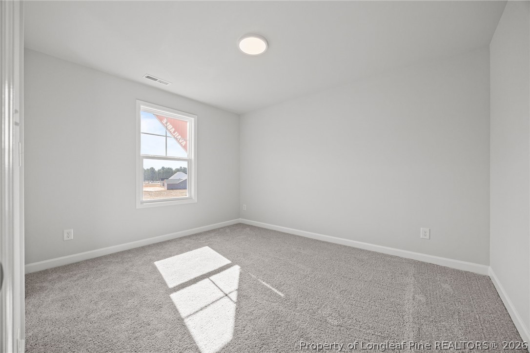 155 Michter Street Vass, NC 28394 - Photo 13 of 46 an empty room with windows