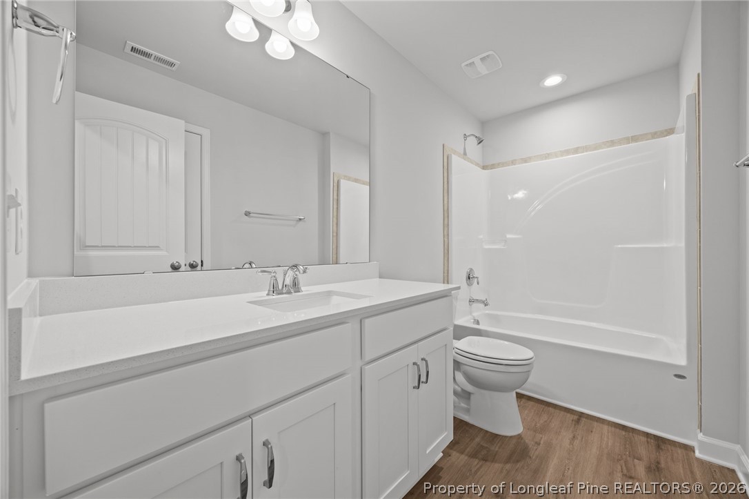 155 Michter Street Vass, NC 28394 - Photo 15 of 46 a bathroom with a sink a toilet and shower