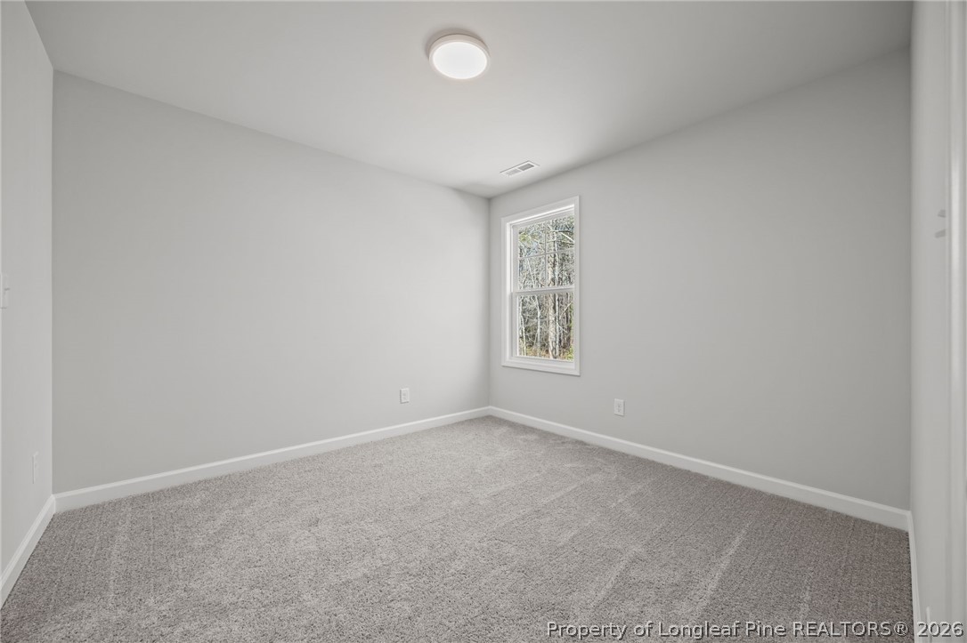 155 Michter Street Vass, NC 28394 - Photo 16 of 46 an empty room with windows