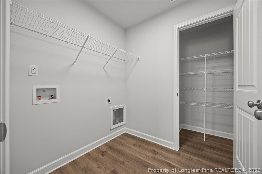 155 Michter Street Vass, NC 28394 - Photo 20 of 46 a view of room with walk in closet and wooden floor