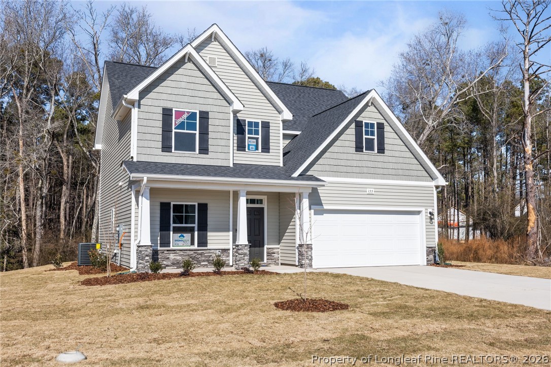 155 Michter Street Vass, NC 28394 - Photo 2 of 46 a view of a house with a yard and large tree