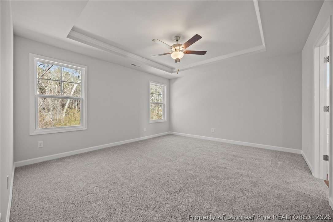 155 Michter Street Vass, NC 28394 - Photo 21 of 46 an empty room with windows and fan