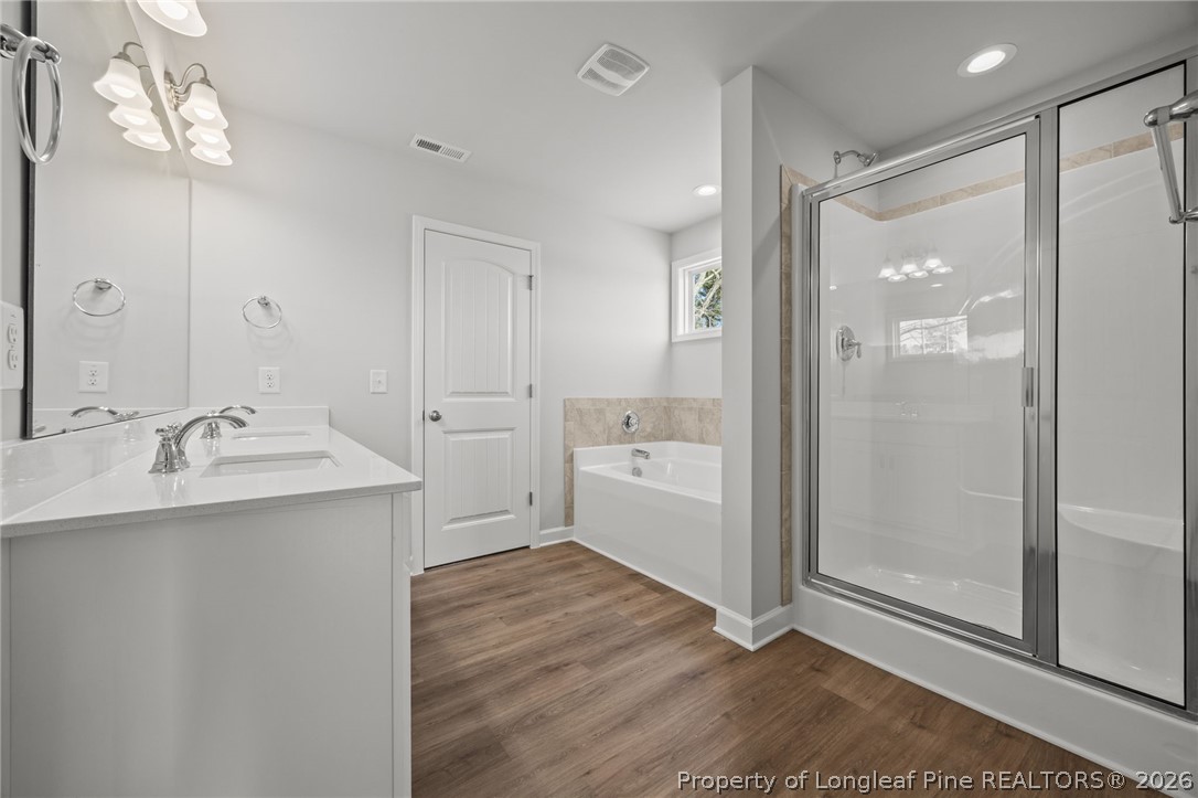 155 Michter Street Vass, NC 28394 - Photo 23 of 46 a bathroom with a sink a toilet and shower