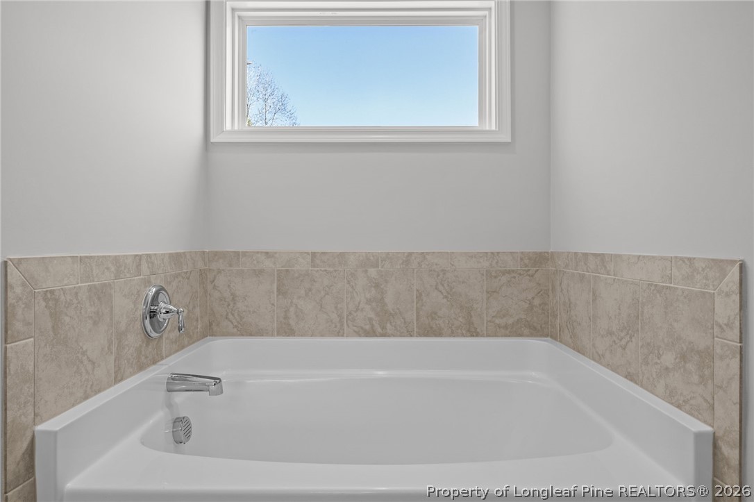 155 Michter Street Vass, NC 28394 - Photo 24 of 46 a bathroom with bathtub