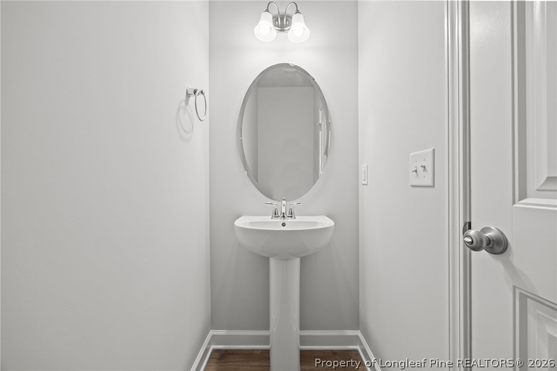 155 Michter Street Vass, NC 28394 - Photo 29 of 46 a bathroom with a sink and a mirror