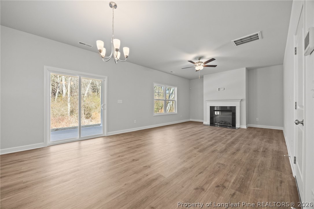 155 Michter Street Vass, NC 28394 - Photo 30 of 46 a view of an empty room with a window and fireplace