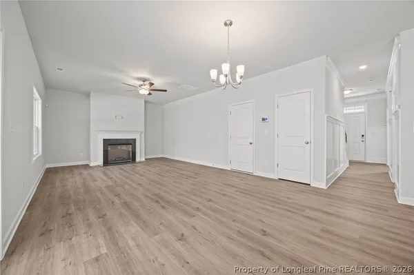 a kitchen with stainless steel appliances granite countertop a sink a stove a microwave and cabinets