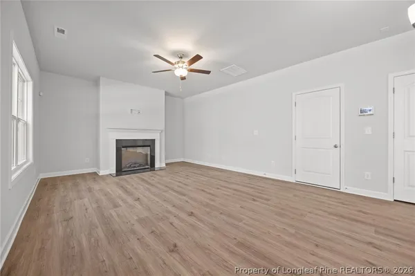 a kitchen with stainless steel appliances granite countertop a sink a window and cabinets