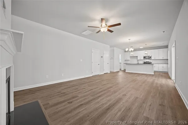 a kitchen with stainless steel appliances granite countertop a stove and a sink