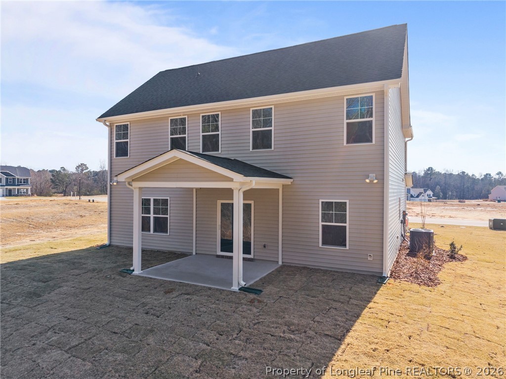 155 Michter Street Vass, NC 28394 - Photo 5 of 46 a front view of a house with a yard and lake view