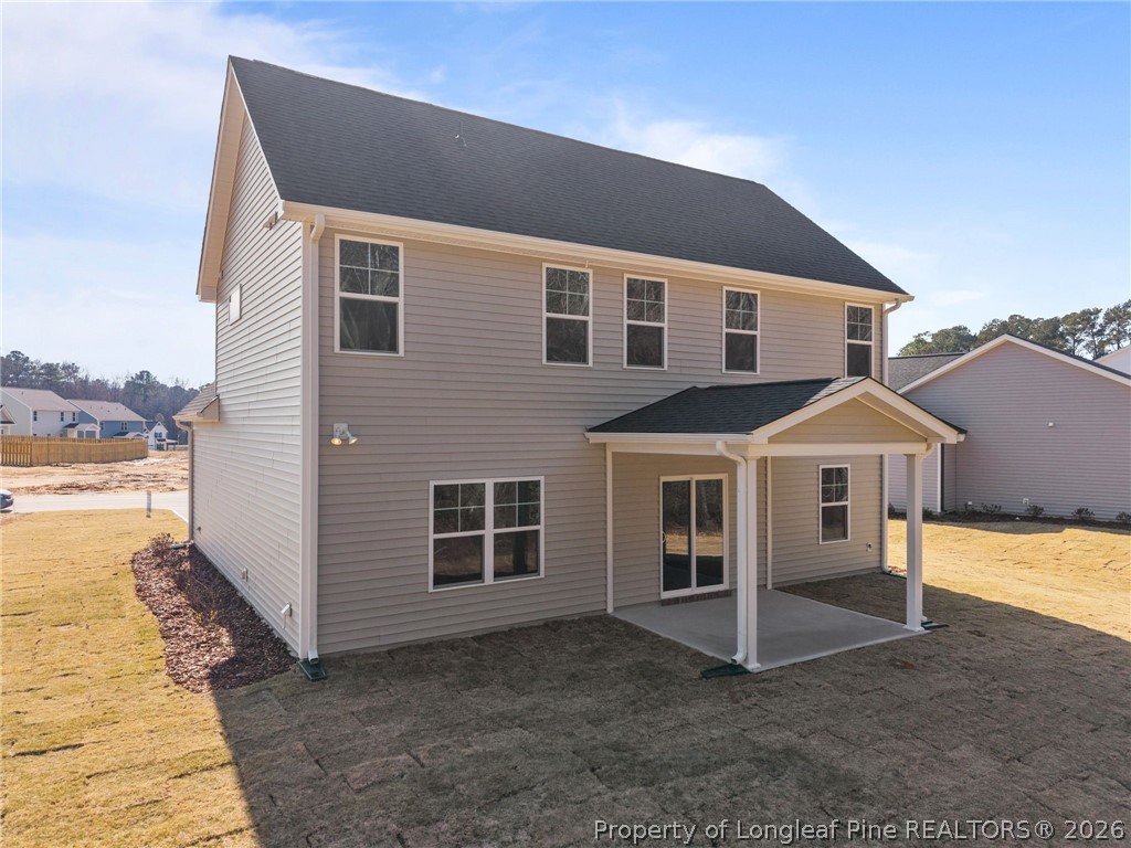 155 Michter Street Vass, NC 28394 - Photo 6 of 46 a front view of a house with a yard and garage