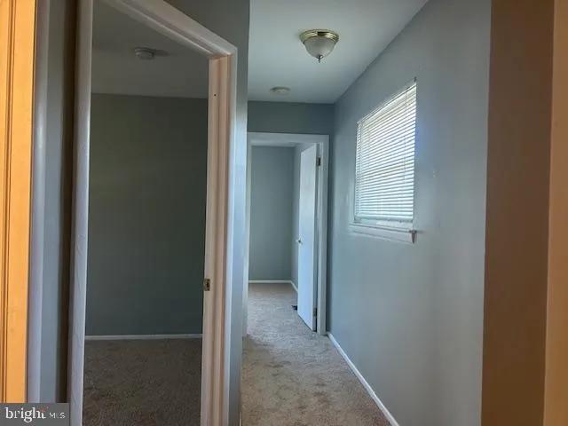 a view of a hallway with an empty room