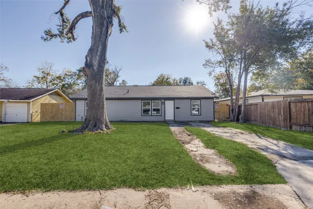 a view of a house with a back yard
