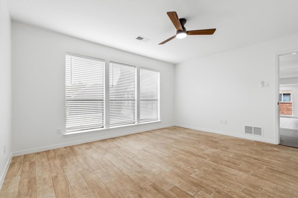 17003 Davenport Road Dallas, TX 75248 - Photo 32 of 40 a view of a livingroom with a ceiling fan and window