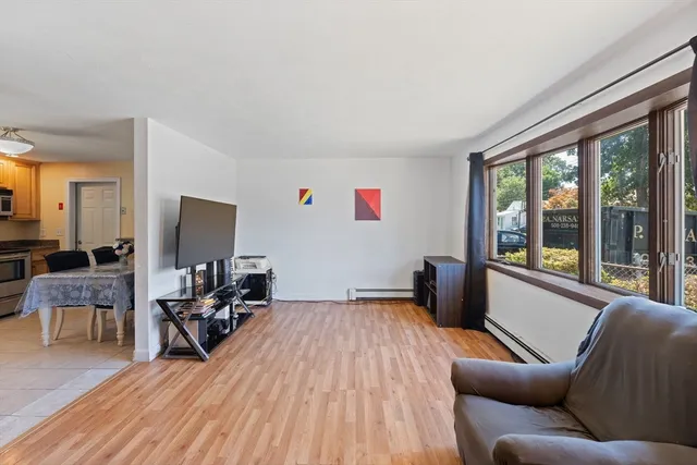 a living room with furniture and a large window