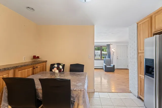 a kitchen with granite countertop a refrigerator and a sink