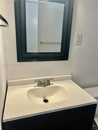 a wooden fence with trees in the background