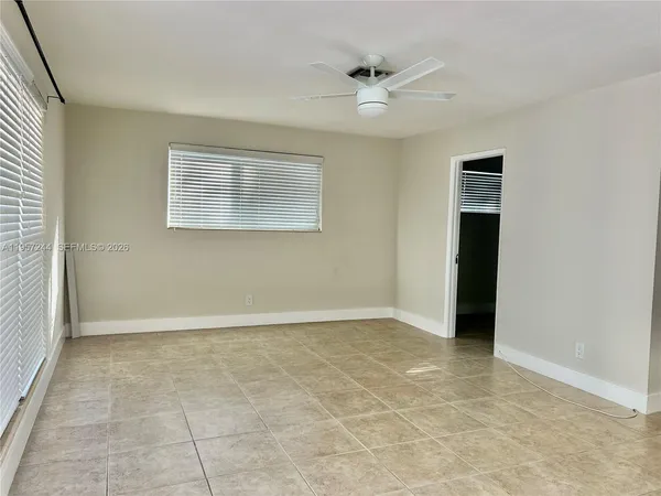 a view of an empty room with a window