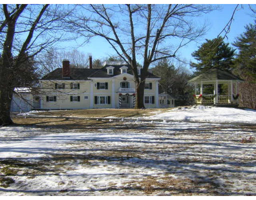1 Old England Road Ipswich, MA 01938 - Photo 1 of 5 a view of a house with a snow in the yard
