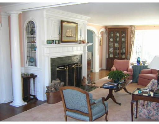 1 Old England Road Ipswich, MA 01938 - Photo 3 of 5 a living room with furniture a fireplace and a large window