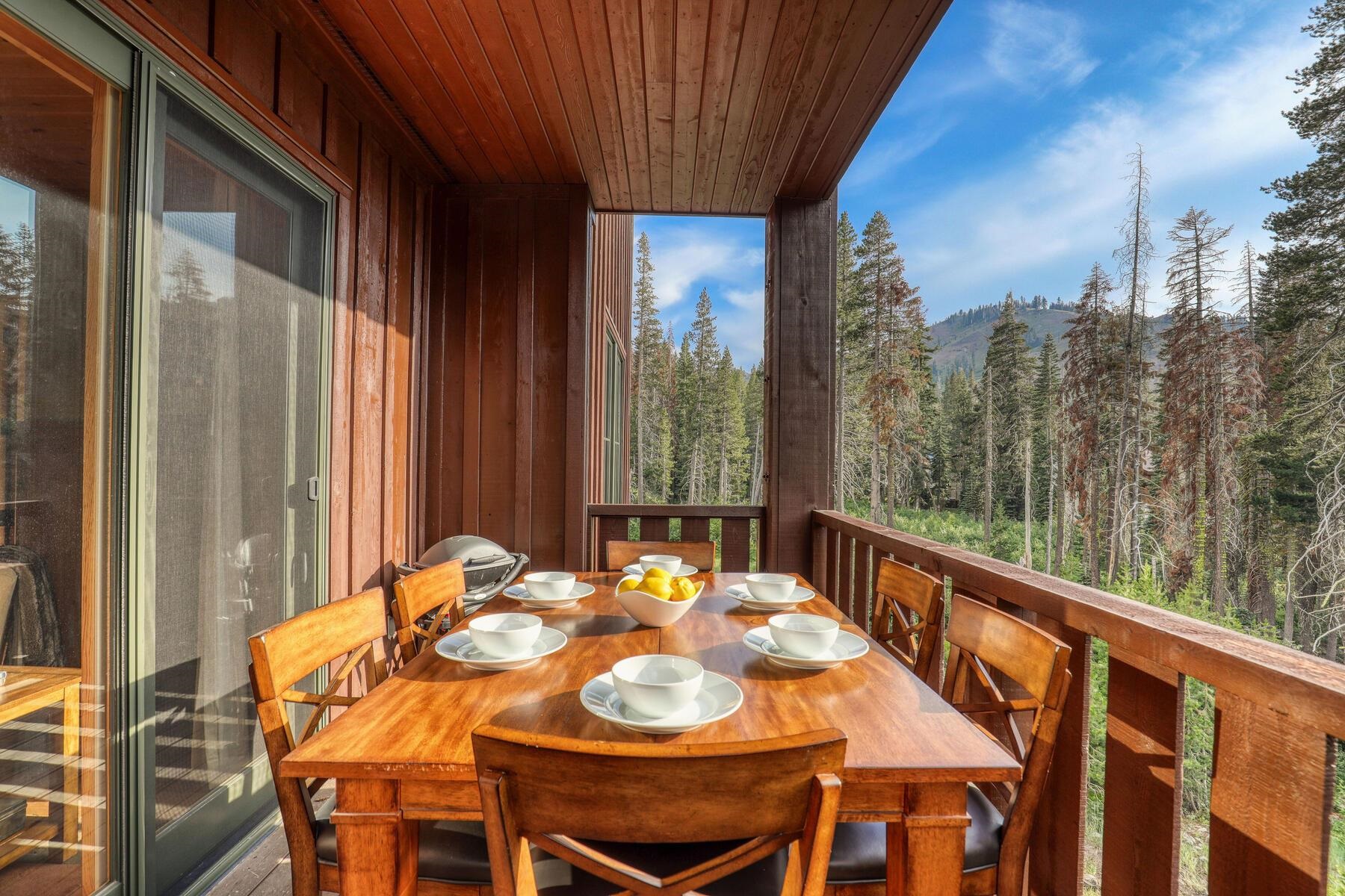 600 Sugar Bowl Road, Unit 211 Truckee, CA 96161 - Photo 18 of 21 a view of a balcony with table and chairs