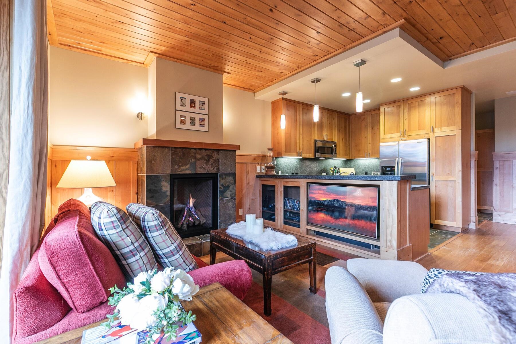 600 Sugar Bowl Road, Unit 211 Truckee, CA 96161 - Photo 2 of 21 a living room with furniture and a fireplace