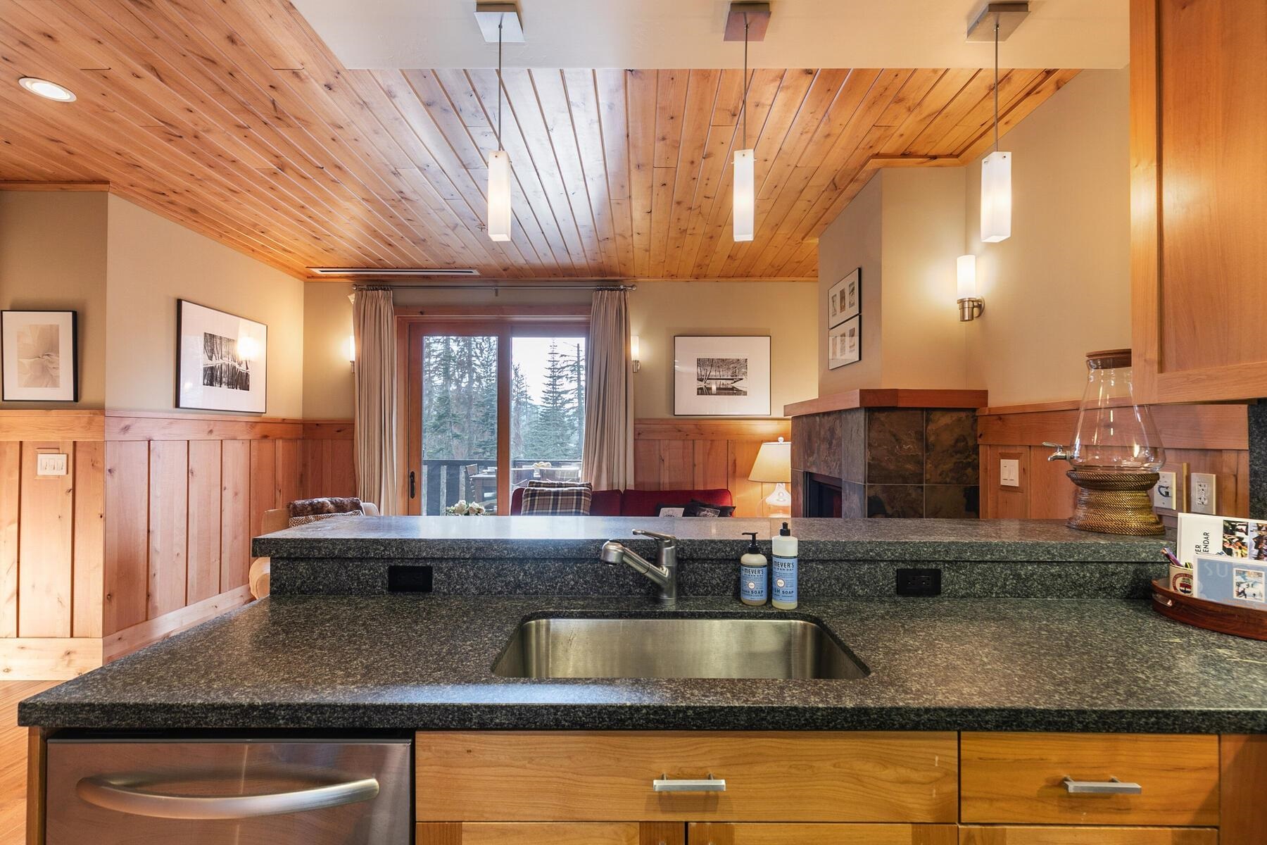 600 Sugar Bowl Road, Unit 211 Truckee, CA 96161 - Photo 5 of 21 a kitchen with kitchen island a sink and a large window